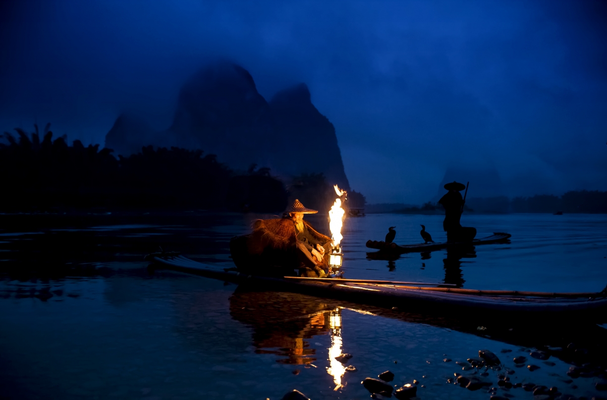 Night scene river fishing boat fisherman cormorant