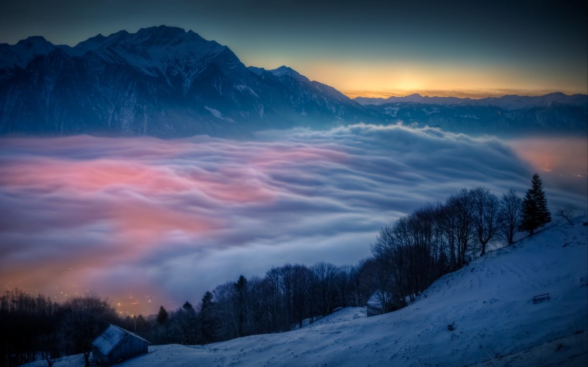 Mountain sunrise snow hut fog trees