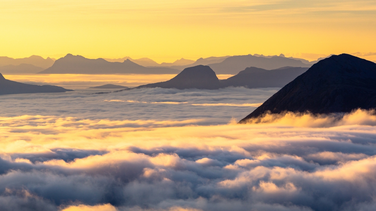 Beautiful sunrise over the mountains and upside down clouds