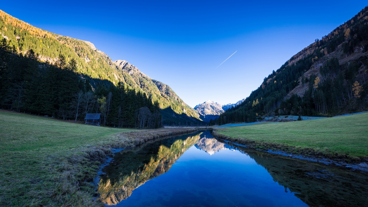 Blue sky mountains creek water landscape pour