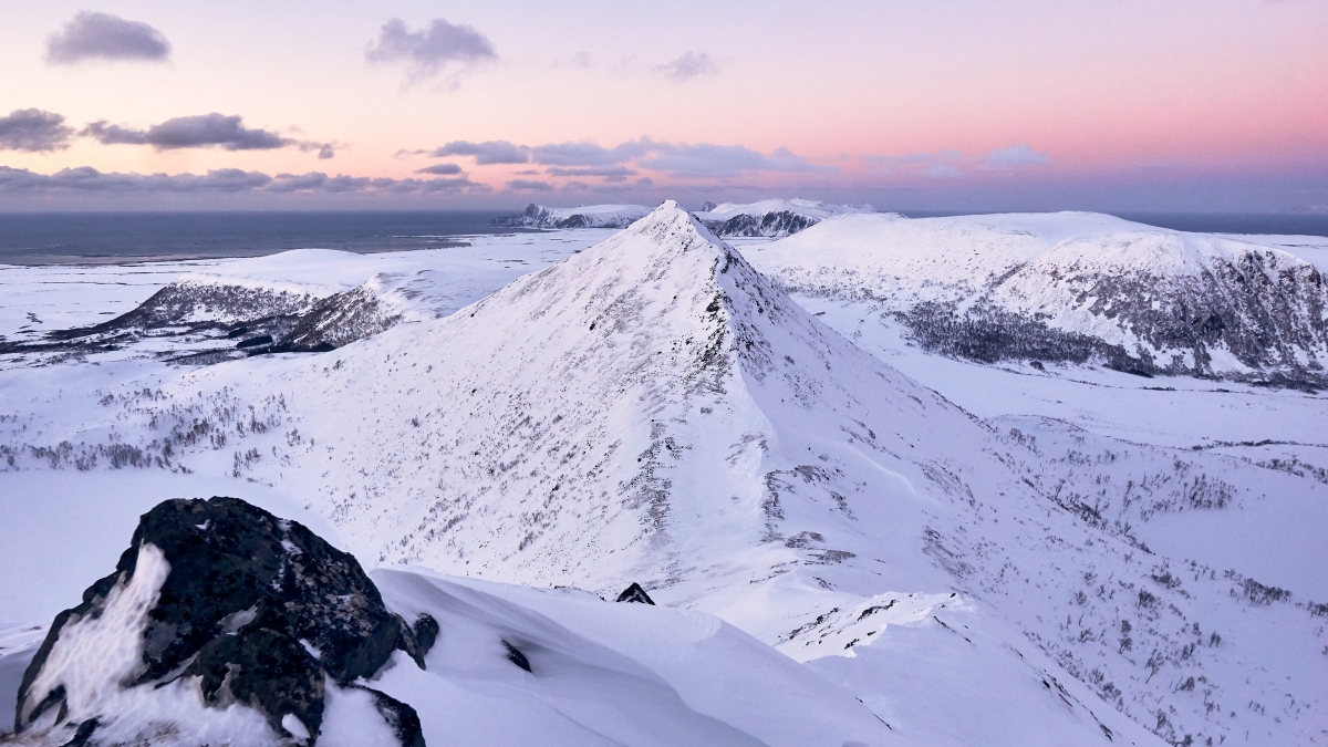 4k landscape wall of snowy mountains at dusk