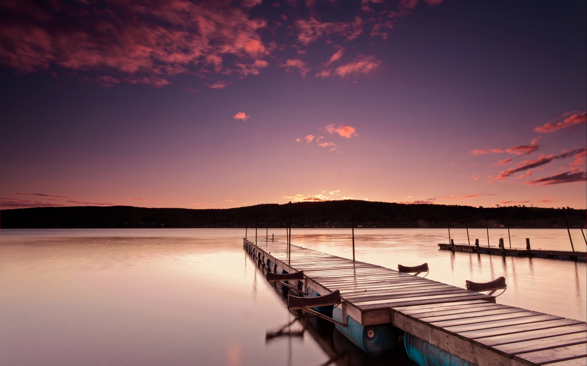 4K landscape wall of the dock by the lake at dusk
