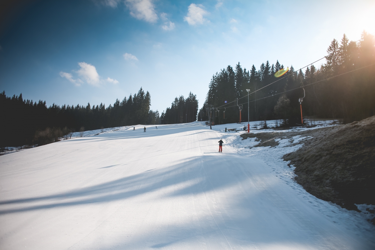 Ski slope with sunny weather 4k wind