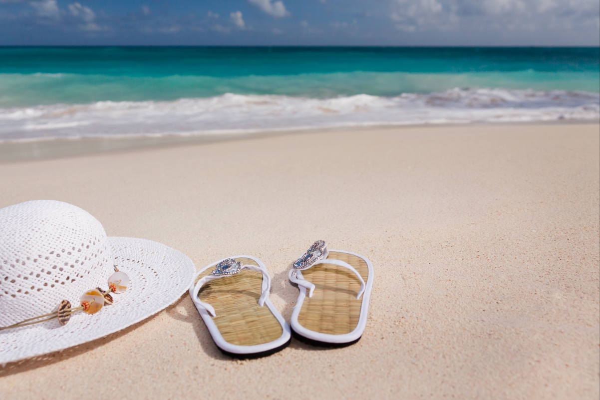 Female flip-flop hat on the beach