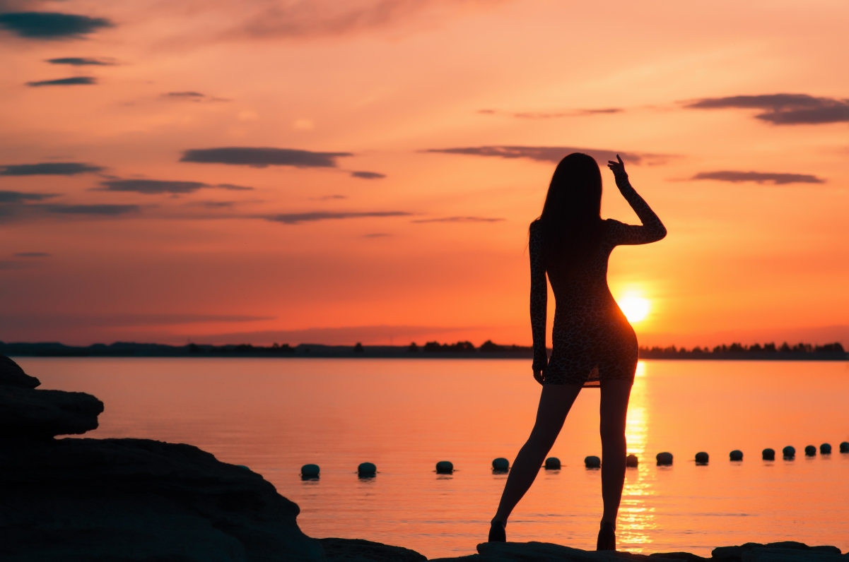 Beautiful girl with long legs at sunset 4k pictures