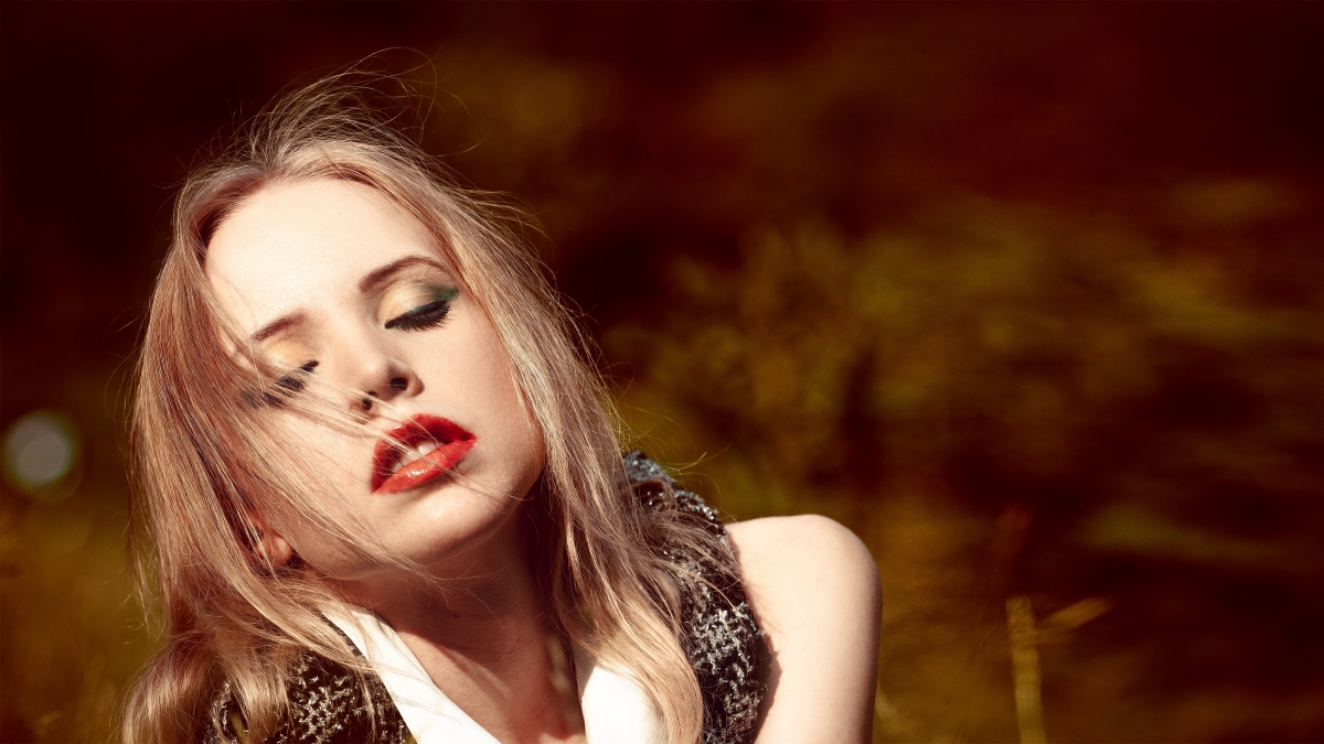 Fashion long haired woman with closed eyes sexy