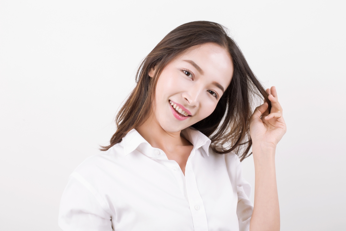 Studio shot fresh, youthful and energetic curly hair girl