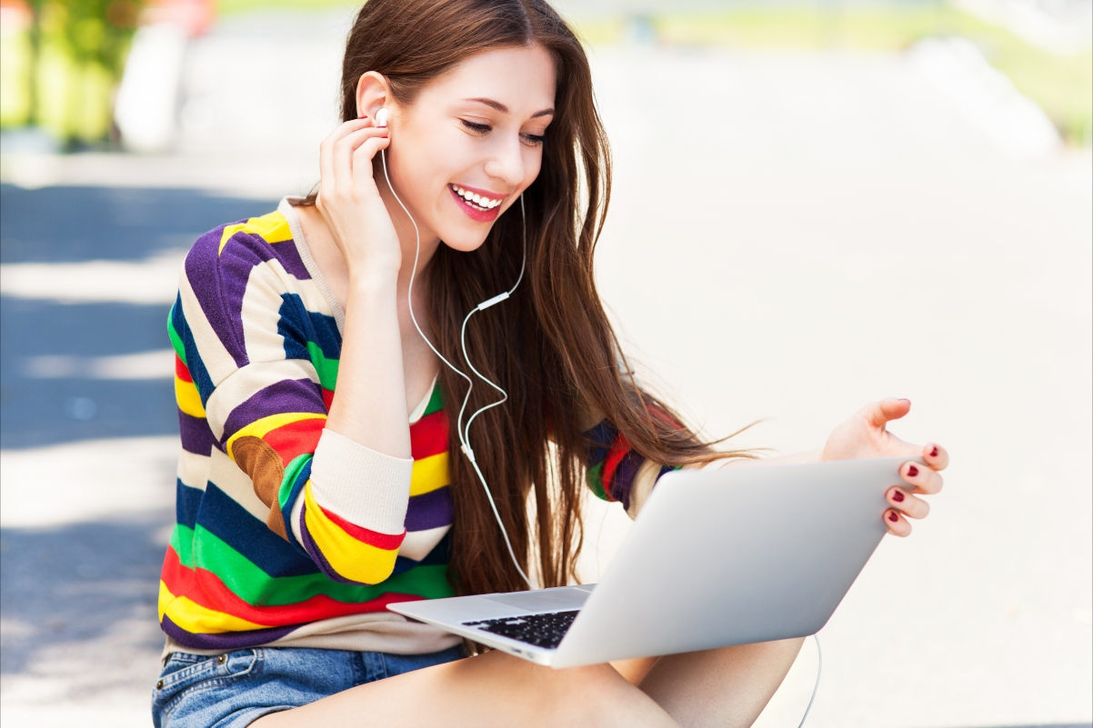 Woman using laptop electricity outdoors