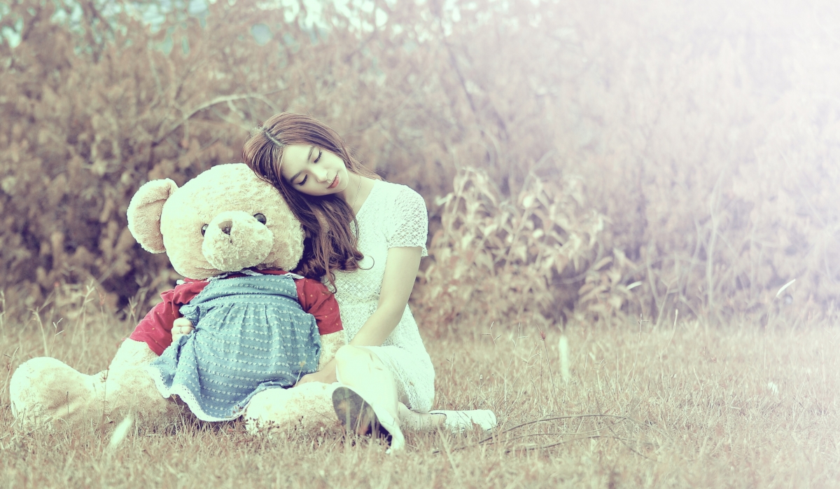 Girl holding teddy bear