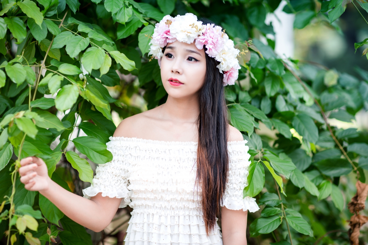 Young stylish fashion model with wreath