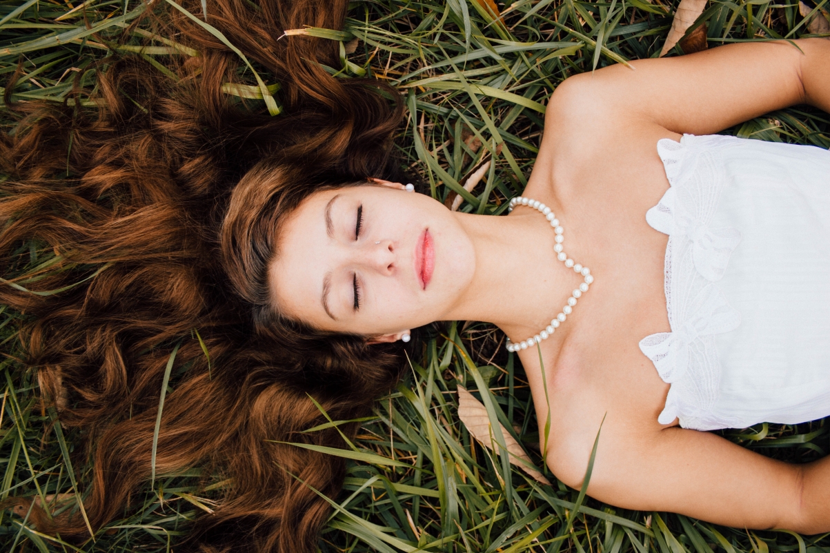 Lying on the grass with your eyes closed