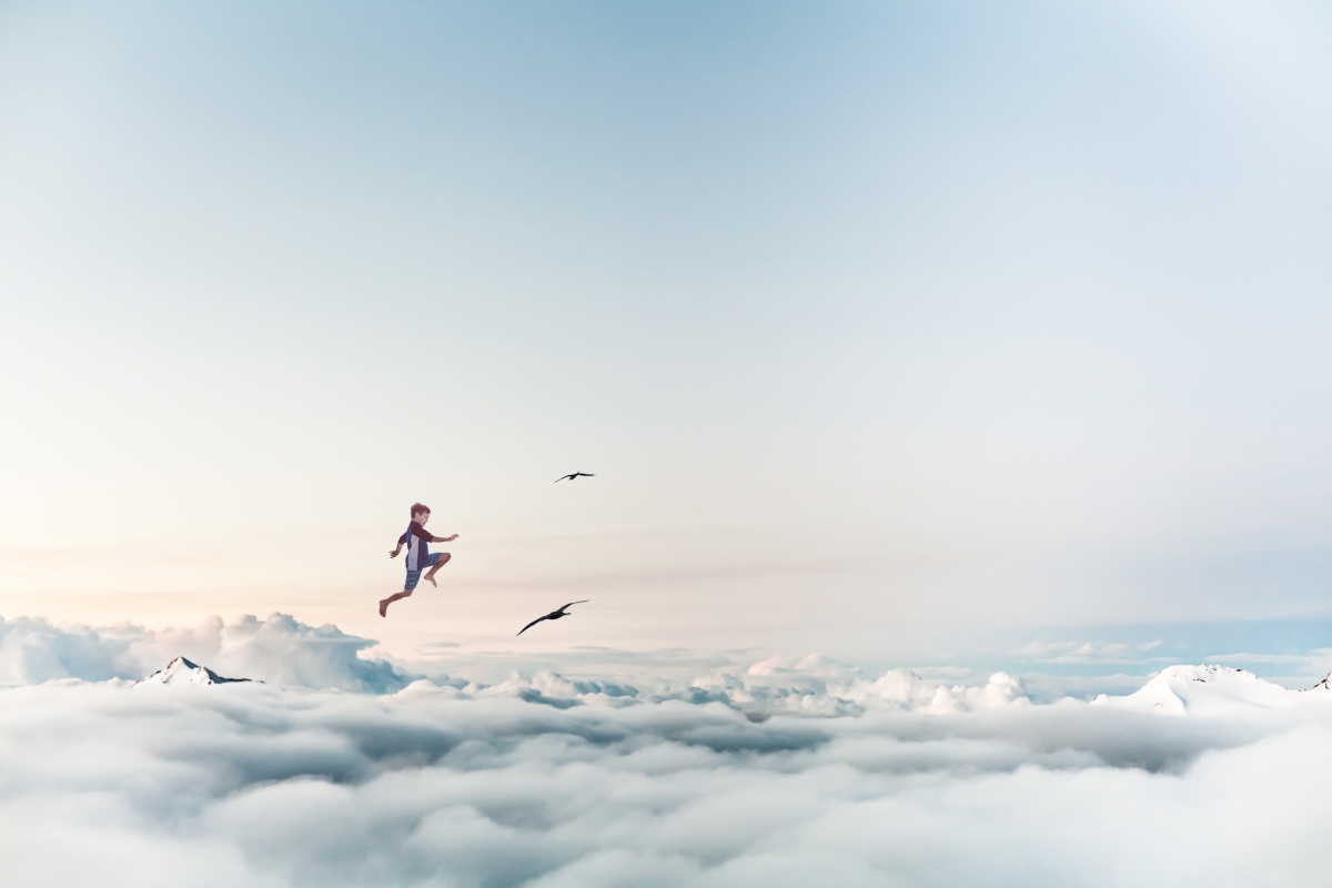 Child flying on the clouds 4k picture
