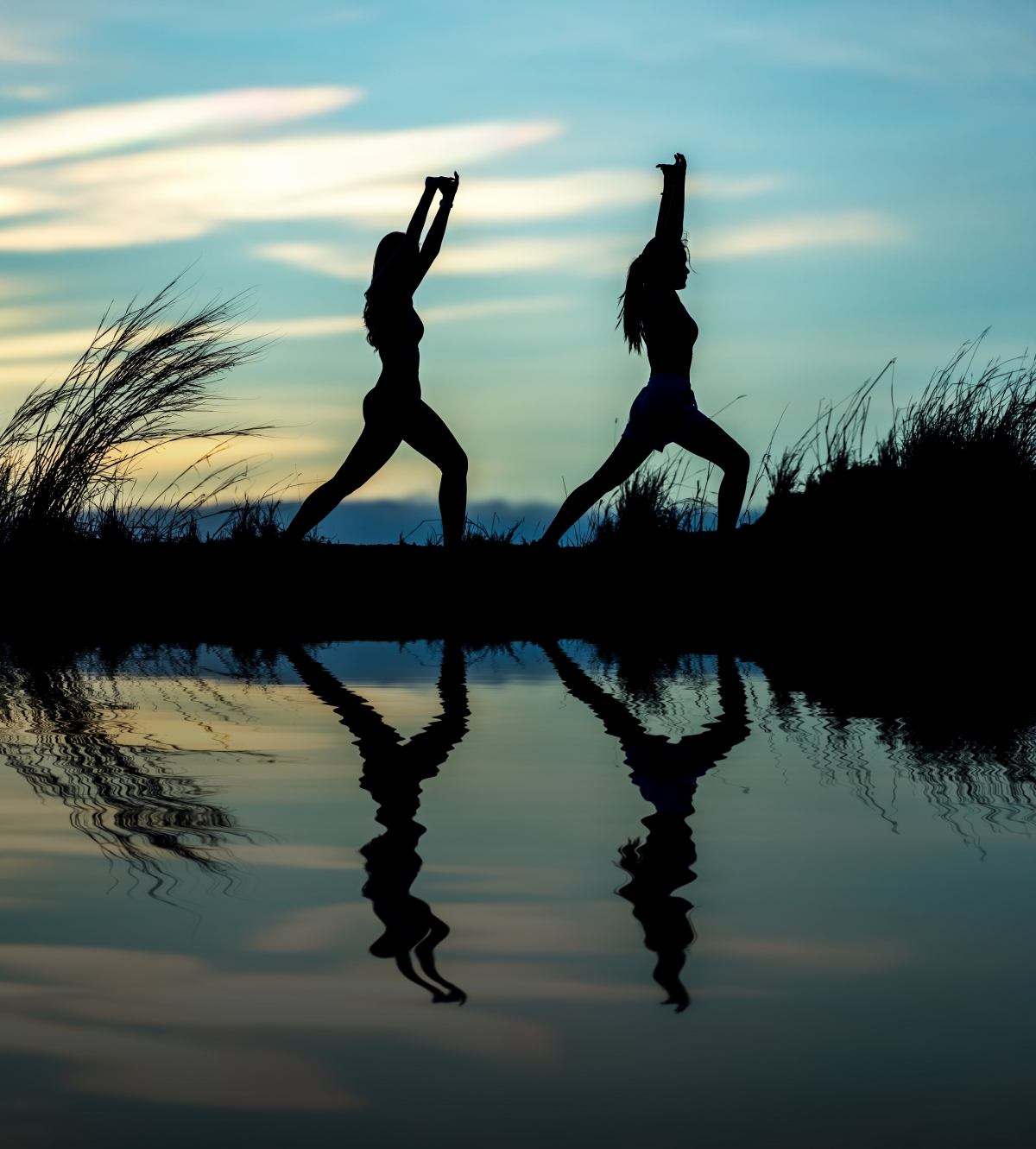 Two girls exercise in the sunset 4k