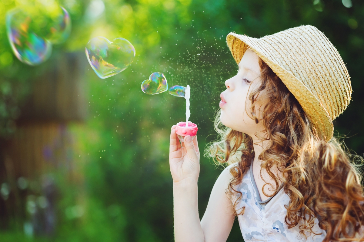 Beautiful bubble, blond little girl, can