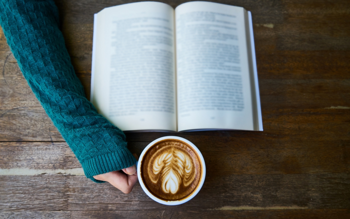 Girl, a good book and a cup of coffee