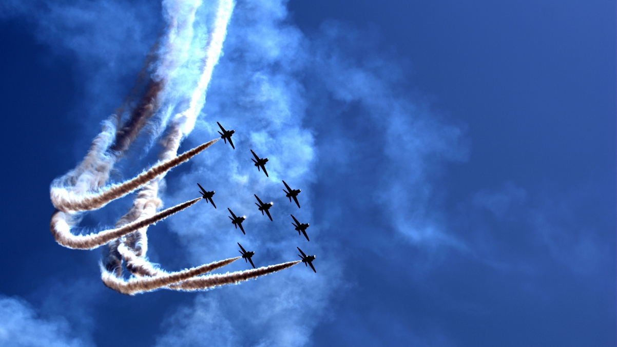 Blue sky airplane smoke 4K wall